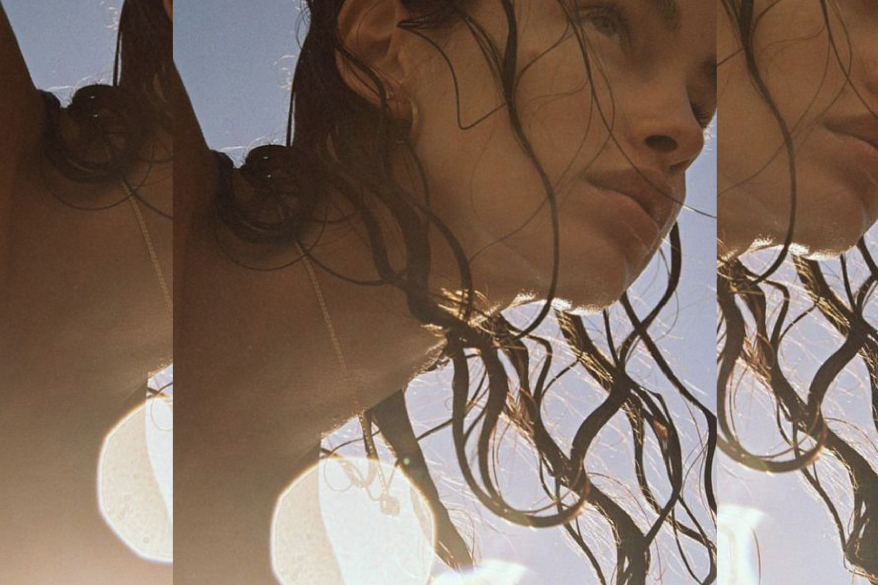 Sunlit close-up of a woman’s face and wet hair repeated in overlapping vertical panels against a clear sky, creating a soft, layered effect with light flares and a warm, natural mood.